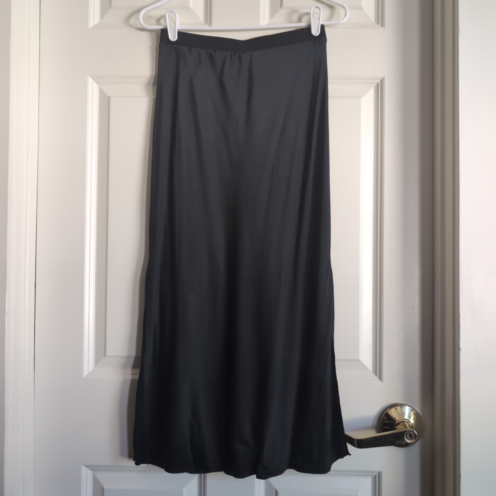 Washed black low rise 100% silk maxi skirt with elastic waistband and side vents